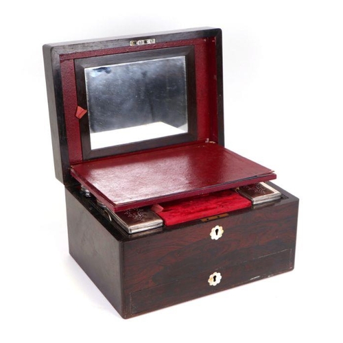 368 - A 19th century rosewood dressing box, the fitted interior with silver plated cosmetic jars and jewel... 