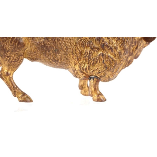 383 - A gilt metal figure depicting a bison, 17cms long.Condition Report The front right leg has been repa... 