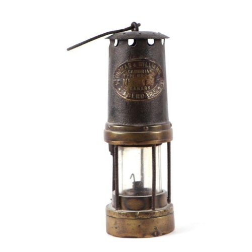 387 - A Thomas & Williams of Aberdare Navy type miner's lamp, 25cms high; together with a brass door k... 