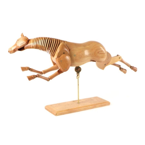 390 - An artist's treen articulated horse model, approx 35cms long, mounted on a plinth.