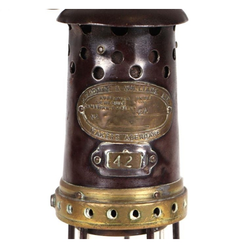 392 - An E Thomas & Williams Ltd Aberdare No. 42 Miner's lamp, 28cms high.