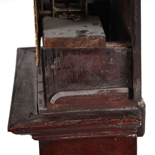 407 - A 19th century longcase clock, the arched brass dial with silvered chapter ring and Roman numerals, ... 