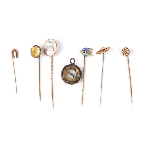 480 - A 9ct gold horseshoe stick pin; together with five other stick pins and a fob compass (7).