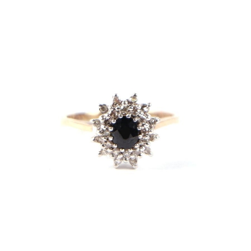 488 - A 9ct gold diamond and sapphire cluster ring, approx UK size 'N'.