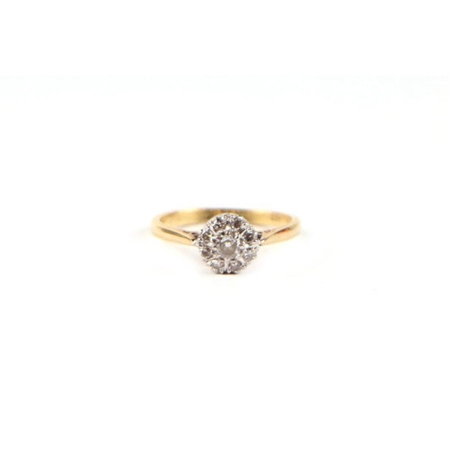 489 - An 18ct gold and diamond cluster ring, approx UK size 'M', 3g.