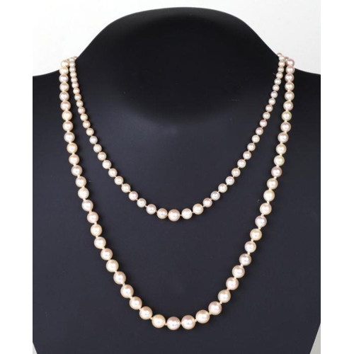 506 - A graduated pearl necklace, 50cms long; together with another similar, 36cms long (2).