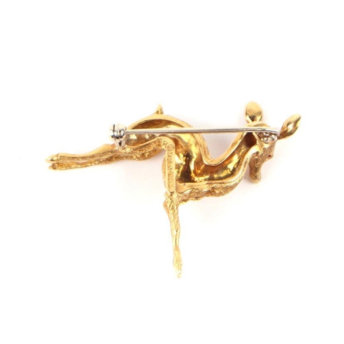 514 - An Italian 18ct gold brooch modelled as a deer with ruby eyes, 9g.