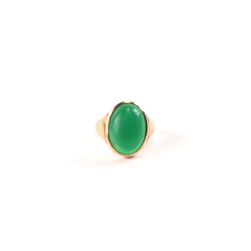 520 - A gentleman's 22ct gold (stamped) green cabochon stone signet ring, approx UK size 'D', 3.7g.