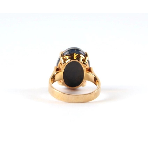 521 - A 14ct gold and black opal cabochon ring, approx UK size 'K', 4.8g.