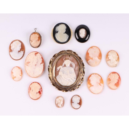 526 - A shell cameo brooch depicting Madonna and child within a Pinchbeck frame, 6cms diameter; together w... 