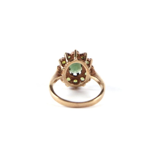 528 - A 9ct gold and peridot cluster ring, approx UK size 'J', 3g.