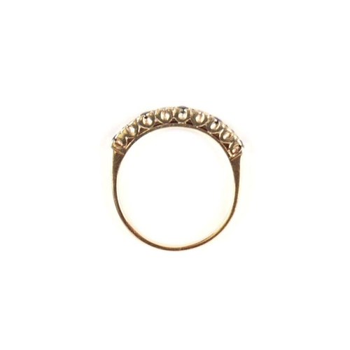 530 - A 9ct gold sapphire and diamond half hoop ring, approx UK size 'P, 2.4g.