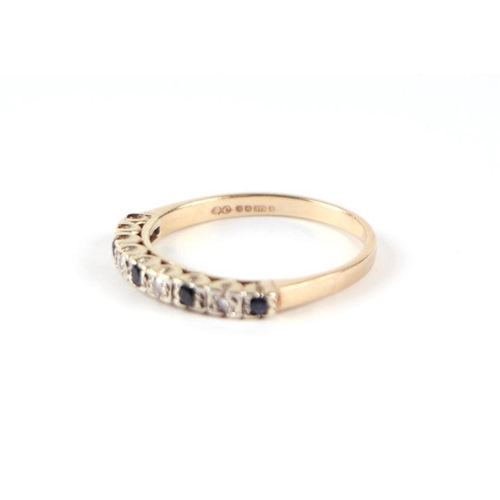 530 - A 9ct gold sapphire and diamond half hoop ring, approx UK size 'P, 2.4g.