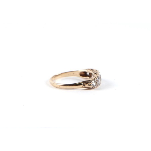 535 - A 9ct gold graduated five white stone half hoop ring, approx UK size 'P', 2.6g.