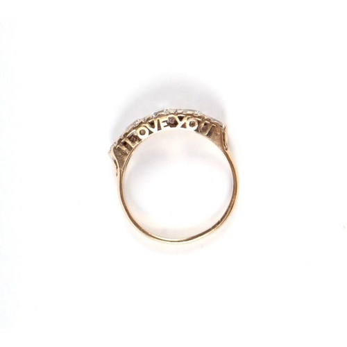 535 - A 9ct gold graduated five white stone half hoop ring, approx UK size 'P', 2.6g.