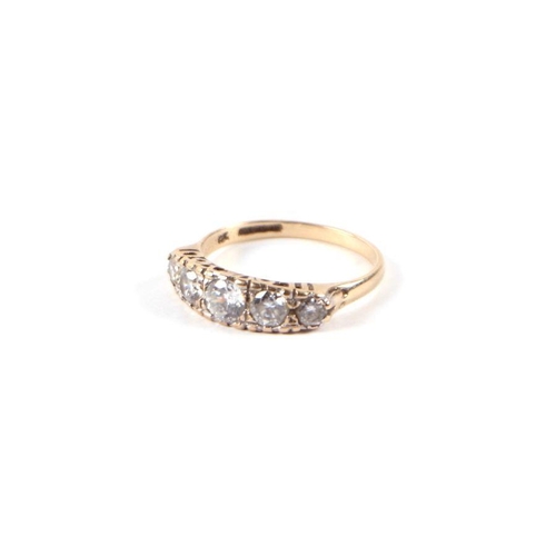 535 - A 9ct gold graduated five white stone half hoop ring, approx UK size 'P', 2.6g.