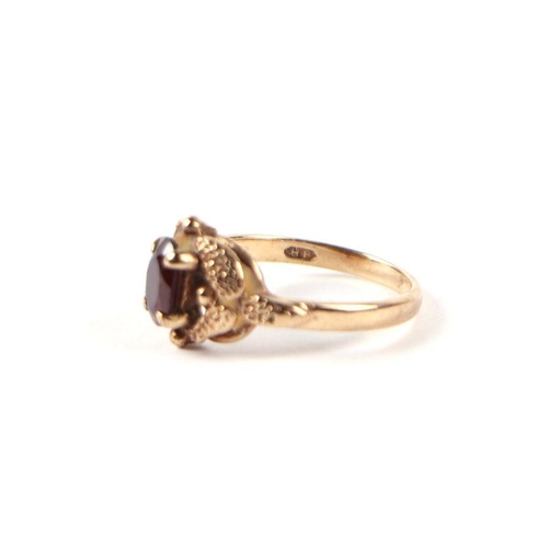 538 - A 9ct gold and solitaire garnet ring, approx UK size 'L', 2.9g.