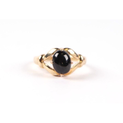 541 - A 9ct gold and cabochon stone open claw set ring, approx UK size N, 2.9g.