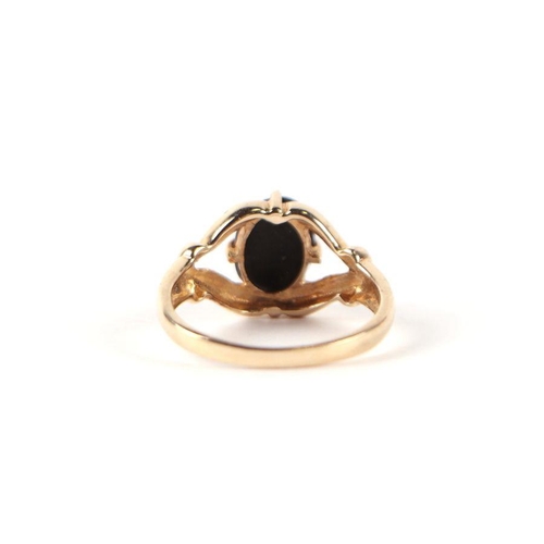 541 - A 9ct gold and cabochon stone open claw set ring, approx UK size N, 2.9g.