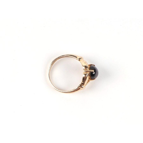 541 - A 9ct gold and cabochon stone open claw set ring, approx UK size N, 2.9g.