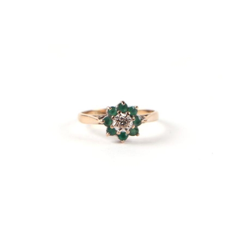 543 - A 9ct gold diamond and emerald flower head cluster ring, approx UK size 'K', 1.8g.