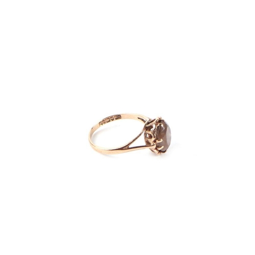 546 - A 9ct gold and smoky quartz solitaire ring, approx UK size 'L', 2.1g.