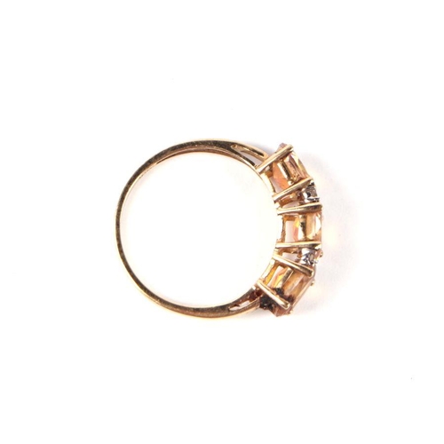 548 - A 9ct gold three pink stone and diamond half hoop ring, approx UK size 'P', 1.9g.