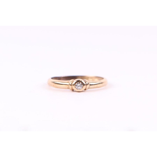 553 - A 9ct gold diamond solitaire ring, approx UK size 'Q', 1.4g.