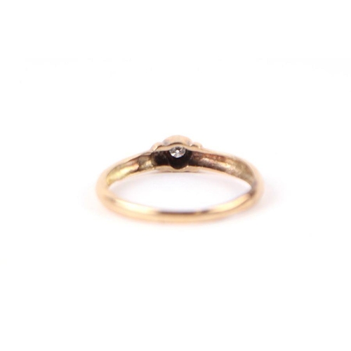 553 - A 9ct gold diamond solitaire ring, approx UK size 'Q', 1.4g.