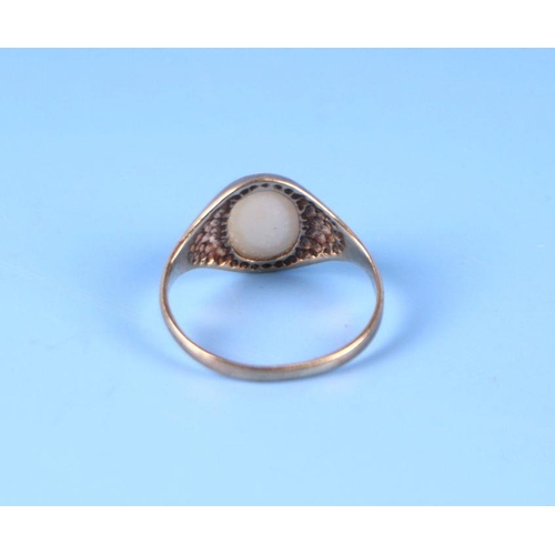 565 - A 9ct gold ring set with an oval opal cabochon, approx UK size 'I', 1.2g.