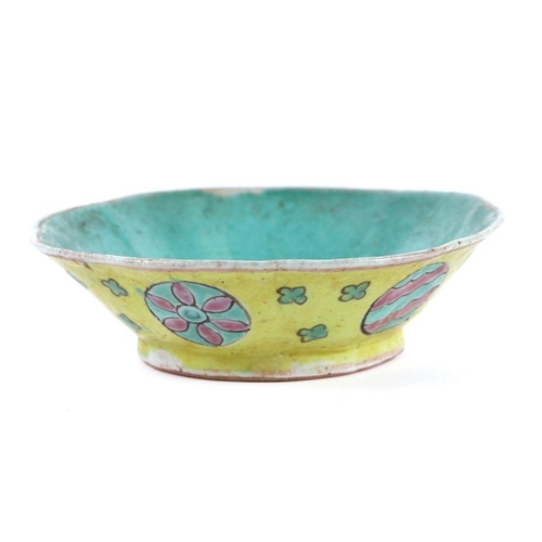 578 - A Chinese yellow ground shallow bowl, 15cms diameter.