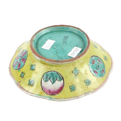 578 - A Chinese yellow ground shallow bowl, 15cms diameter.