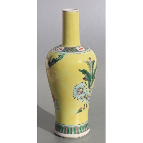 582 - A Chinese bottle vase decorated with figures in a landscape, on a yellow ground, 27cms high. Conditi... 