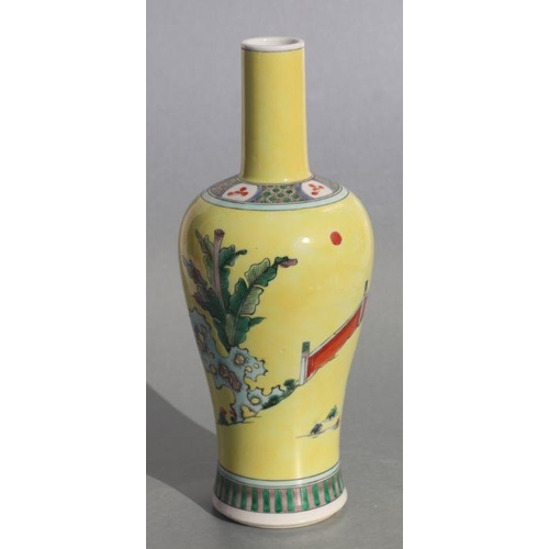 582 - A Chinese bottle vase decorated with figures in a landscape, on a yellow ground, 27cms high. Conditi... 