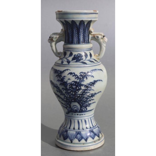 583 - A Chinese blue & white baluster vase with elephant handles and foliate decoration, 23cms high.