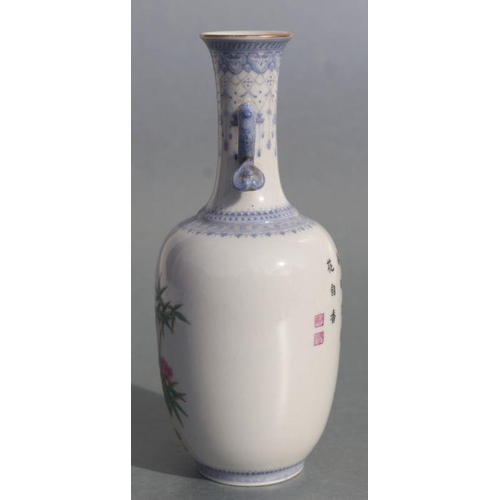 584 - A Chinese republic style famille rose two-handled vase decorated with bamboo and roses, four charact... 