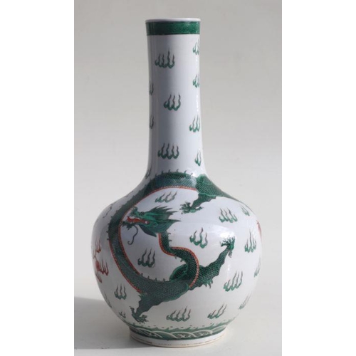 586 - A Chinese famille verte bottle vase decorated with dragons chasing a flaming pearl, blue character m... 