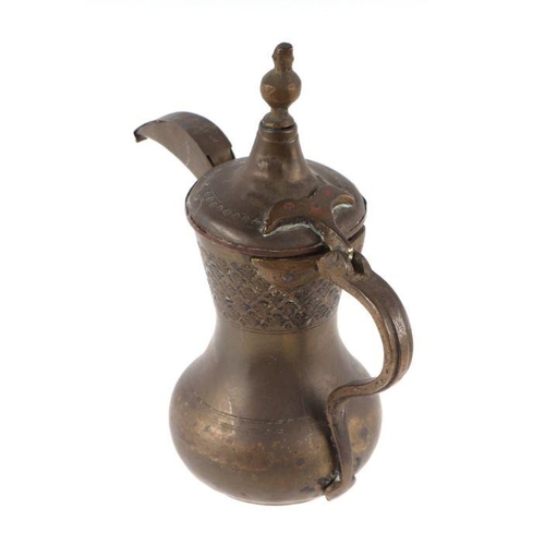 590 - A Turkish / Islamic brass dallah coffee pot, 27cms high.