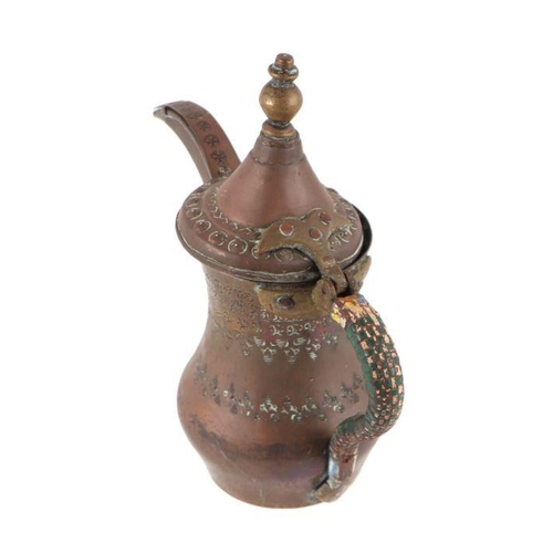 591 - A Turkish / Islamic brass dallah coffee pot, 24cms high.