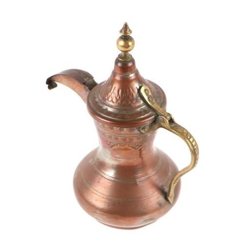 592 - A Turkish / Islamic tinned copper dallah coffee pot, 23cms high.