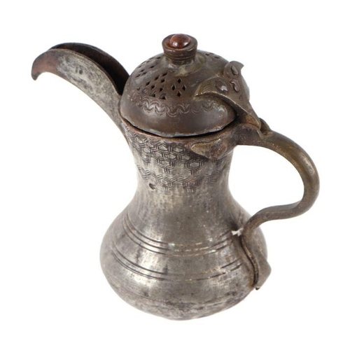 593 - A Turkish / Islamic tinned copper coffee pot, 18cms high.