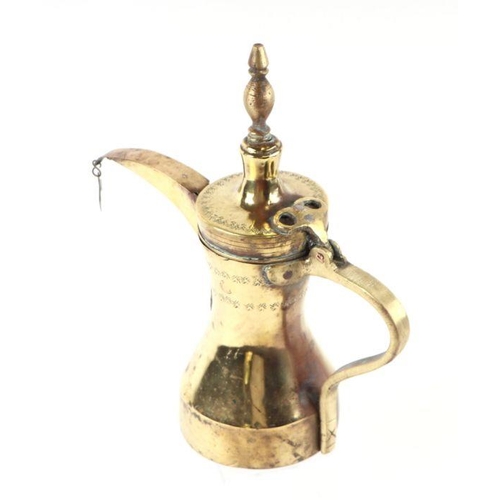 594 - A Turkish / Islamic brass dallah coffee pot, 29cms high.