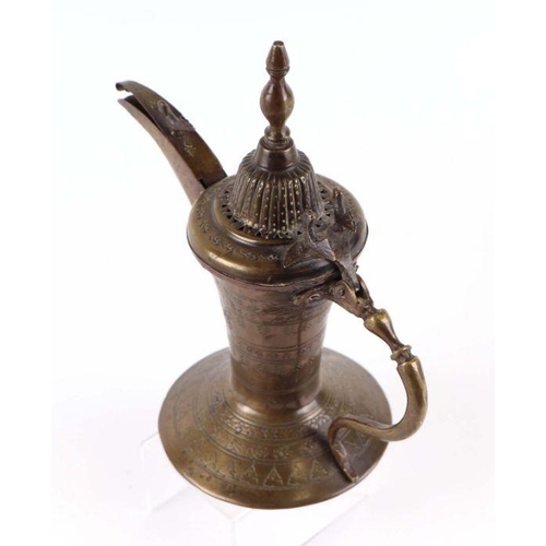 598 - A Turkish / Islamic brass dallah coffee pot, 26cms high.