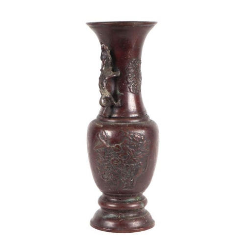 606 - A late 19th century Japanese bronze two-handled vase decorated with birds and flowers, 35cms high.