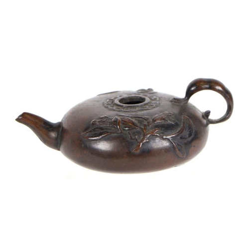 617 - A 19th century Chinese bronze water dropper of compressed circular form, decorated with lily pads, 8... 