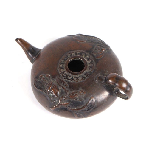 617 - A 19th century Chinese bronze water dropper of compressed circular form, decorated with lily pads, 8... 