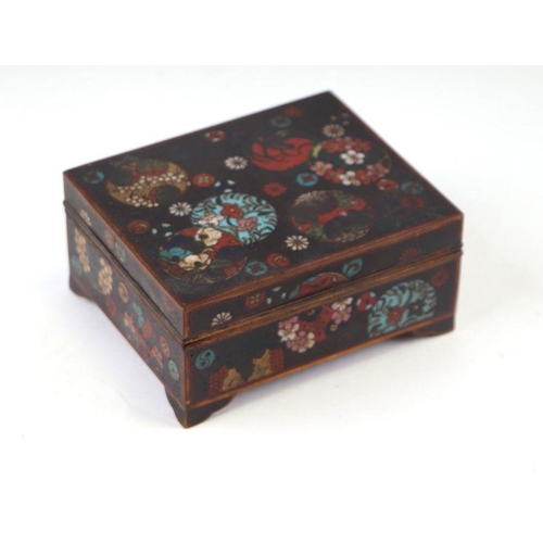 619 - A late 19th century Japanese cloisonné box and cover decorated with butterflies and flowers, on a bl... 