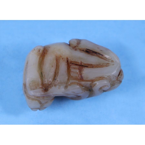 620 - A Chinese mutton fat jade carving in the form of a rabbit, 4cms wide.