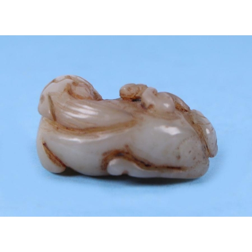 620 - A Chinese mutton fat jade carving in the form of a rabbit, 4cms wide.