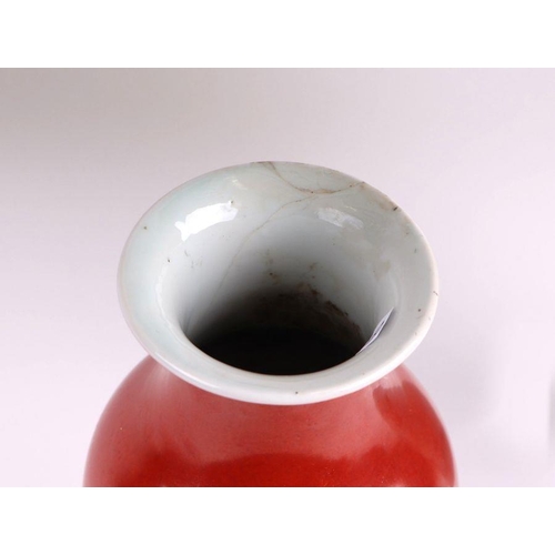 634 - A Chinese monochrome vase with rust red glaze, 23cms high; together with a Chinese famille rose vase... 